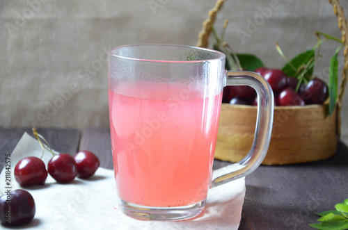 Wallpaper Mural Kissel with cherries in a glass on an old wooden background, traditional russia or poland drink, berry jelly, mousse, summer pink drink, Torontodigital.ca