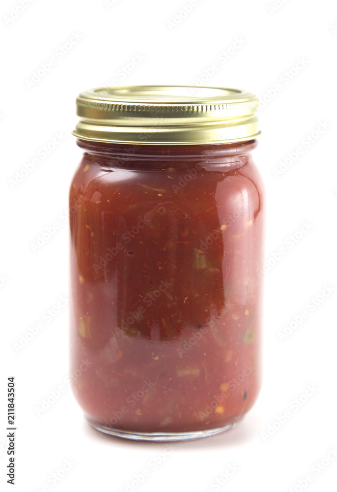 Homemade Salsa in a Home Canning Jar on a White Background Homemade Salsa in a Home Canning Jar on a White Background