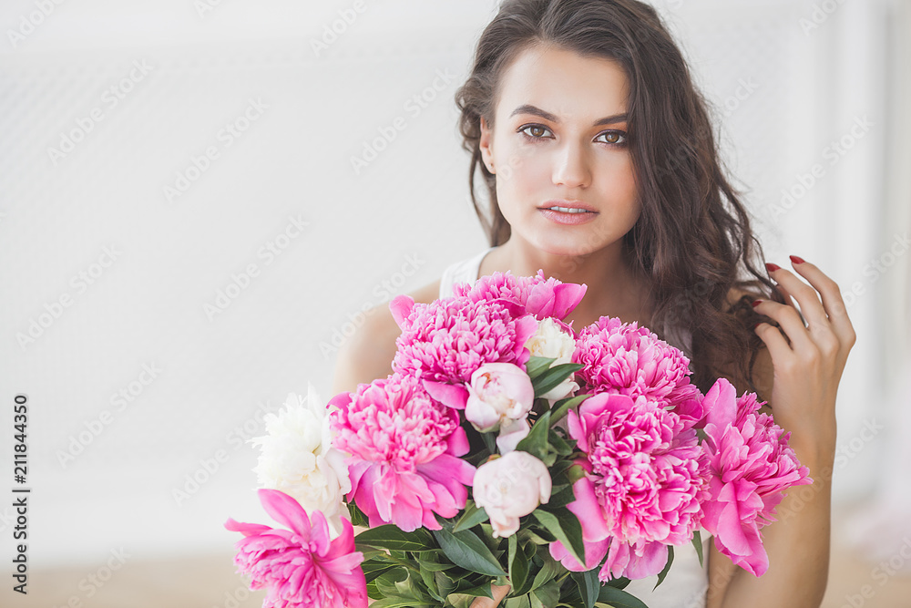 Young attractive woman with flowers