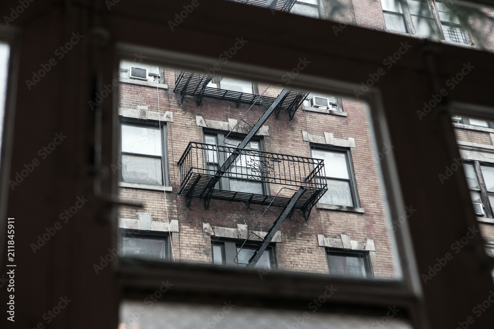 An urban view of a fire stairwell in the middle of New York City.