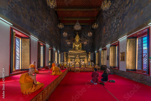 The worship of monks And the blessings of the people at church of Wat Ratchanatda Temple popular place in Bangkok Thailand photo