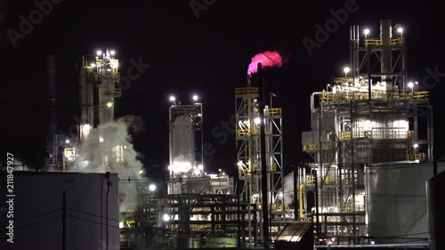 Wallpaper Mural Smoking oil refinery plant with flame at night - United States Torontodigital.ca
