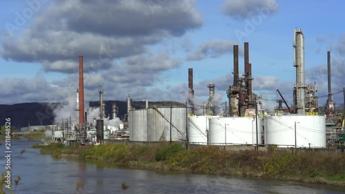 Riverside smoking oil refinery plant landscape - United States photo