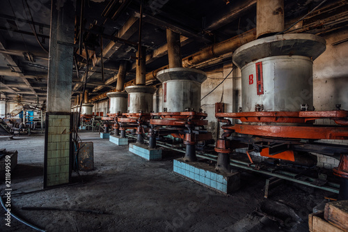 Abandoned tea factory with remnant of rusty equipment 