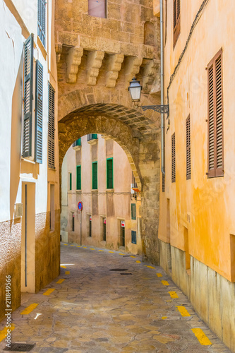 View of a narrow street in the historical center of Palma de Mallorca, Spain photo