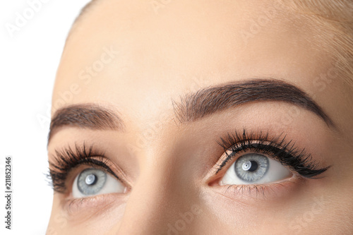 Young woman with beautiful eyebrows after correction, closeup