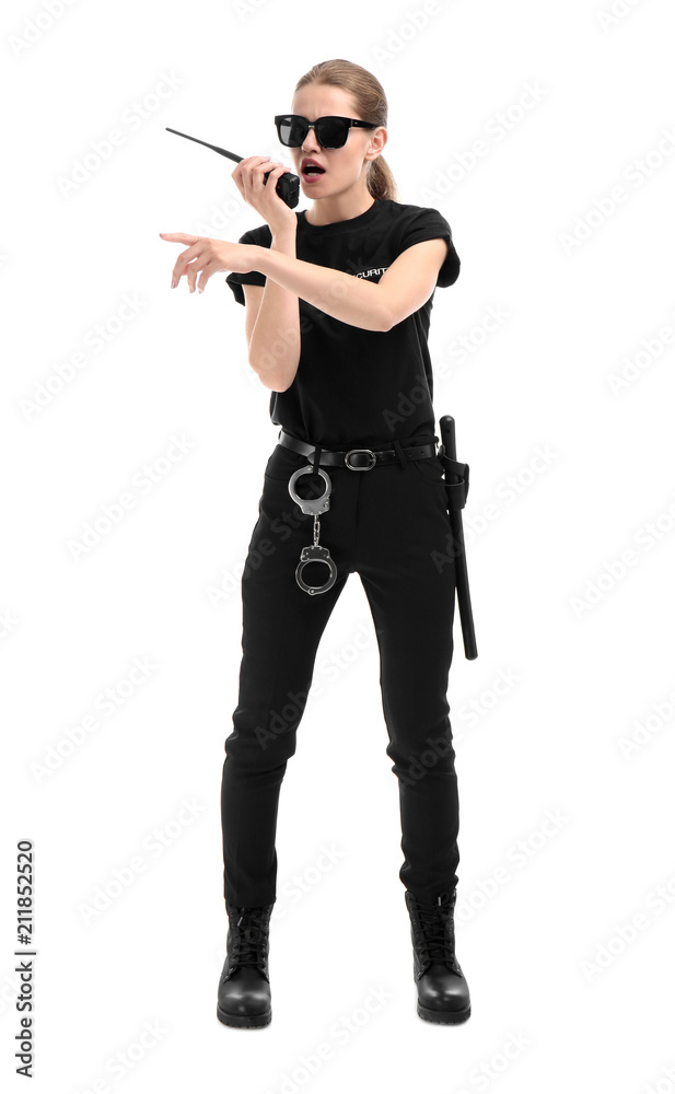 Female security guard using portable radio transmitter on white background Female security guard using portable radio transmitter on white background
