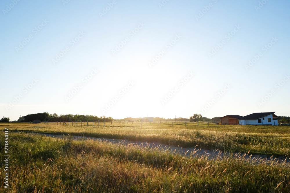 Picturesque view of countryside with houses in field
