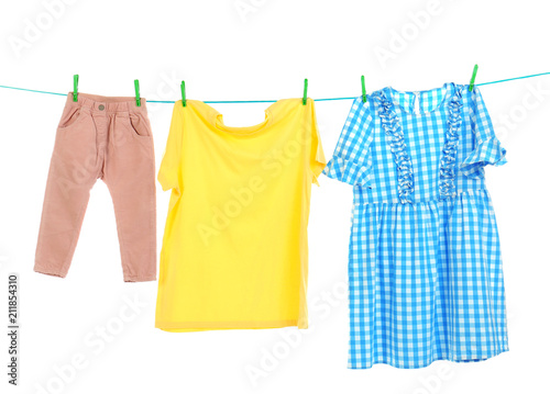 Clothes on laundry line against white background
