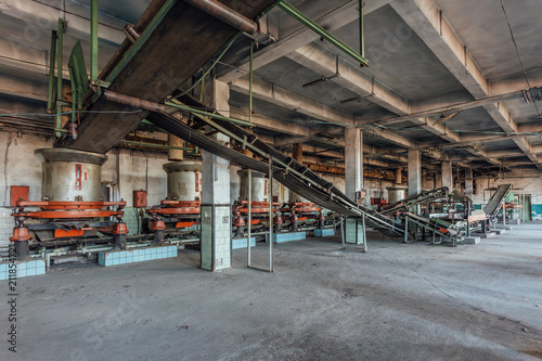 Abandoned tea factory with remnant of rusty equipment 