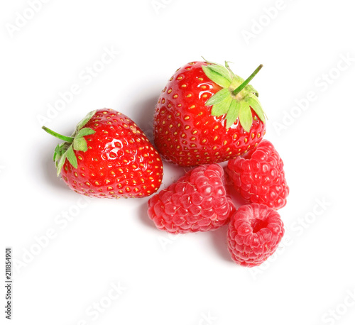 Raspberries and strawberries on white background