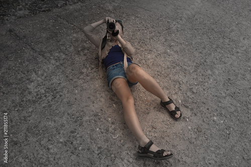 Fotografija Young woman is in the creative process of photographing