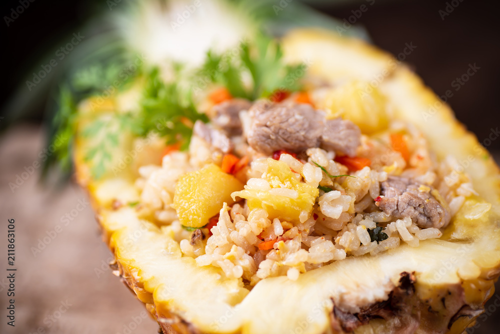 Fried rice with pork in half pineapple fruit, Thai cuisine Fried rice with pork in half pineapple fruit, Thai cuisine