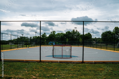 Roller Hockey Or Futsal Soccer Court with Cage Around and Cloudy Sky