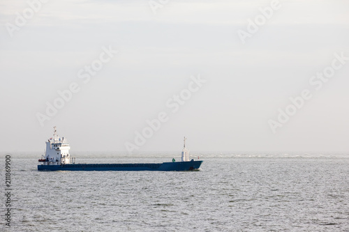 freight ship at sea © denboma