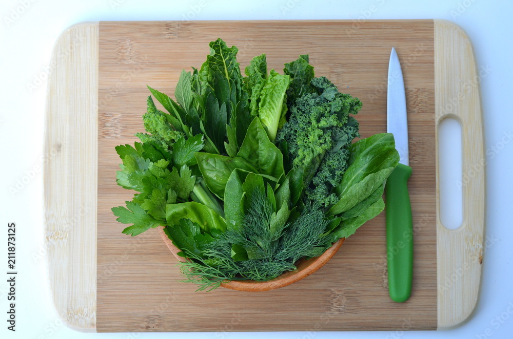 Top view flat layout of fresh culinary herbs and green leafy vegetables on a bamboo cutting board with copy space. Background for nutrition, food, health, cooking, diet and weight loss themes.
Top view flat layout of fresh culinary herbs and green leafy vegetables on a bamboo cutting board with copy space. Background for nutrition, food, health, cooking, diet and weight loss themes.