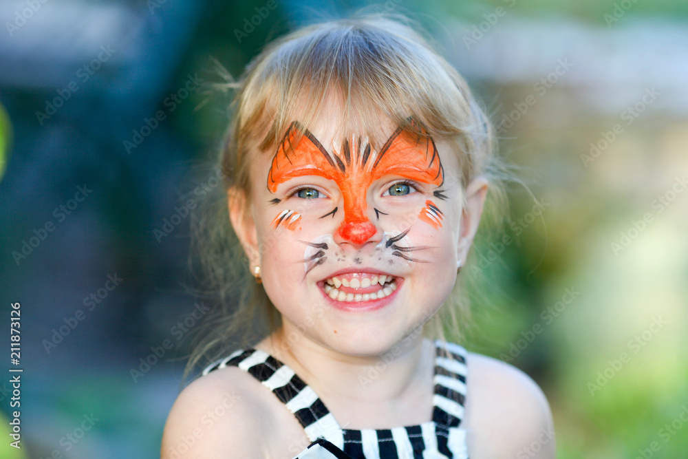 Portrait of funny girl with face painting on blurred background Portrait of funny girl with face painting on blurred background