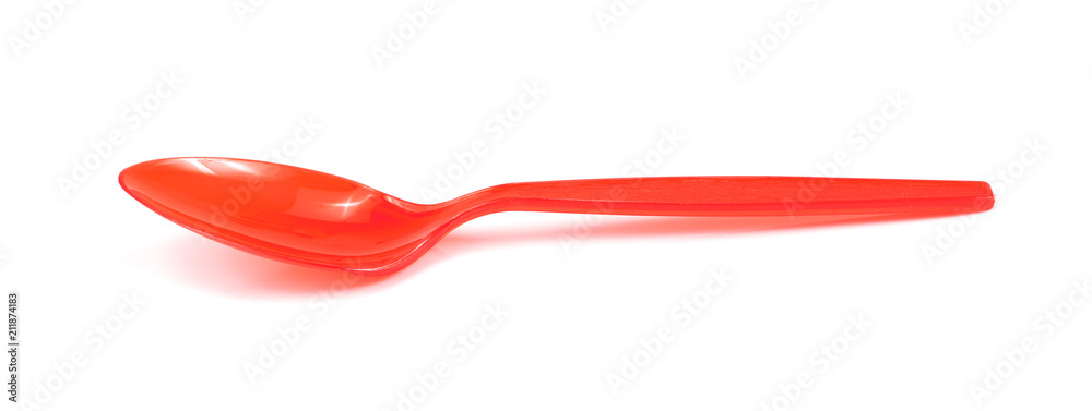 Red plastic spoon isolated on white background Red plastic spoon isolated on white background