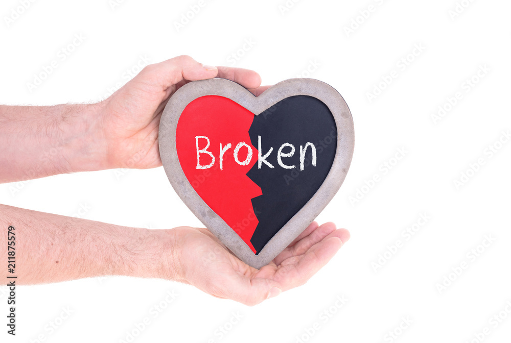 Adult holding heart shaped chalkboard - Broken