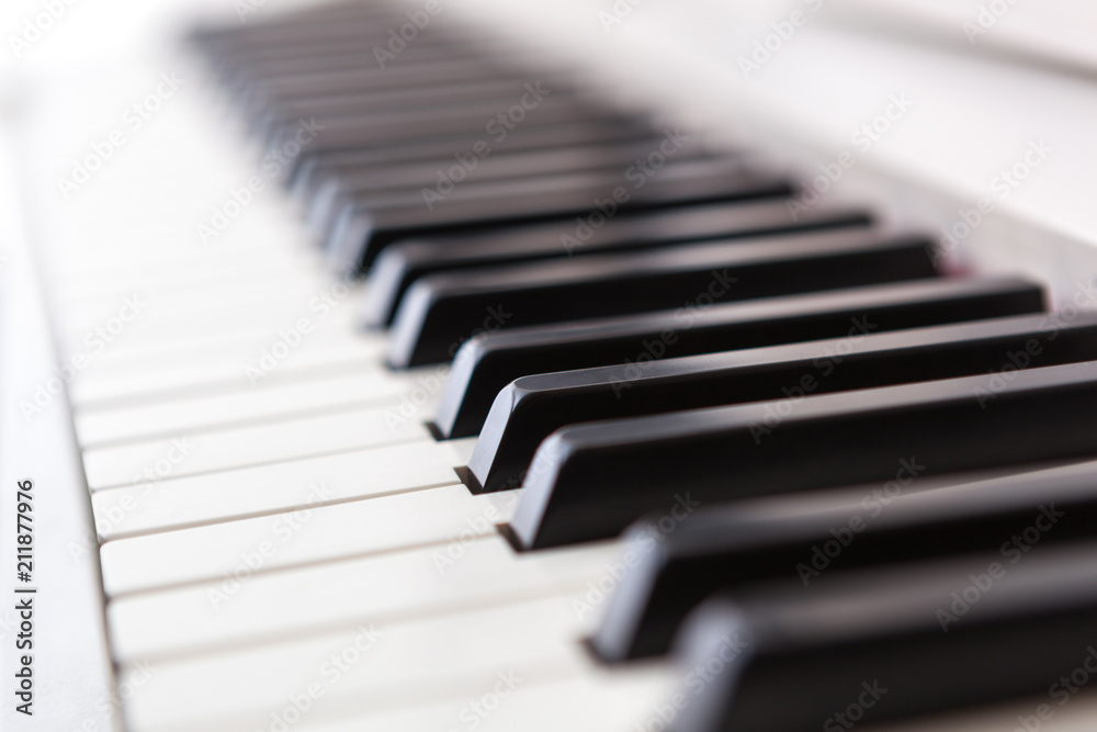 Close up of black and white piano keys. Close up of black and white piano keys.