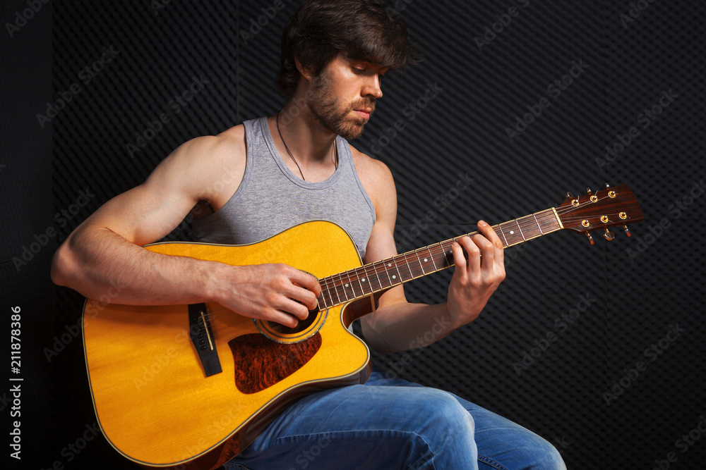 Obraz premium Handsome rock guitarist practicing.