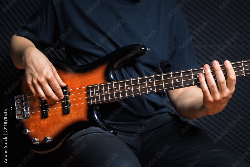 Rock bass guitarist practicing. Rock bass guitarist practicing.
