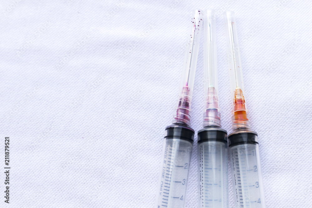 Medical injection syringe as using drugs or hospital service concept ...