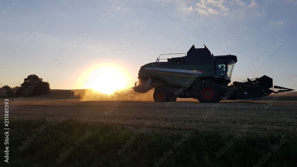 harvester with sunset harvester with sunset