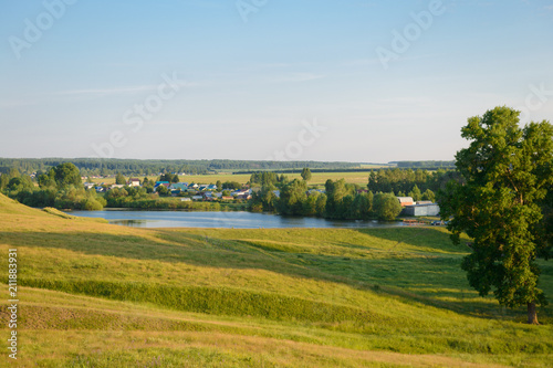June 30  2018  Rural landscape with a village  green forests and fields. The village of Mokry. Chuvashia. Russia.
