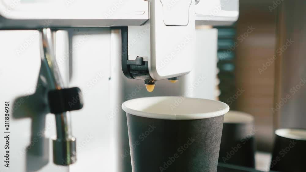 Process of making coffee by coffee machine pour coffee into the cup Process of making coffee by coffee machine pour coffee into the cup
