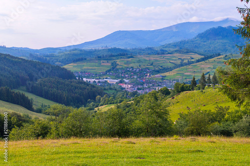 green slope with excellent views of the mountains and the city below