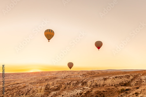View of Hot air balloons flying in sunset sky