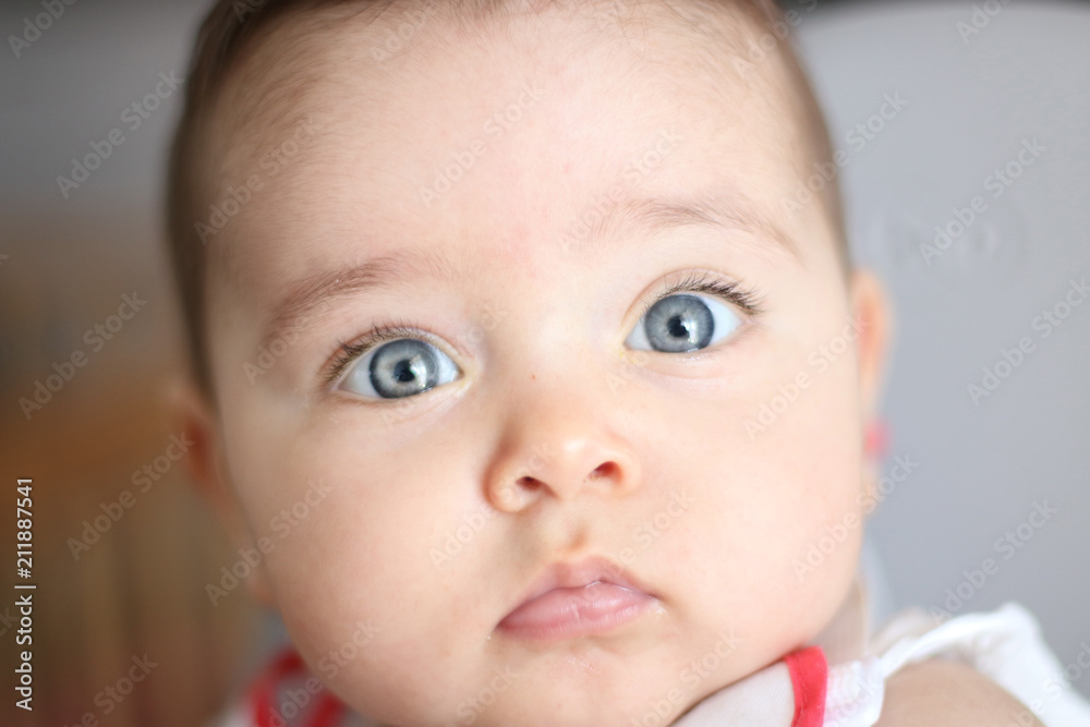 Portrait of lovely baby with blue eyes
