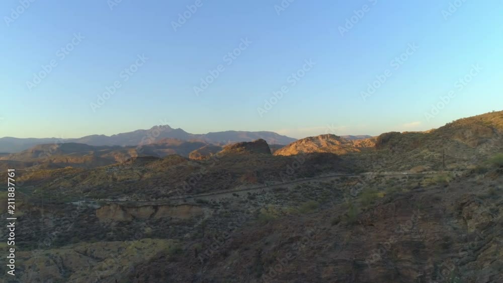 Aerial of Arizona Highway in the Desert Superstition Mountains with Greenery
