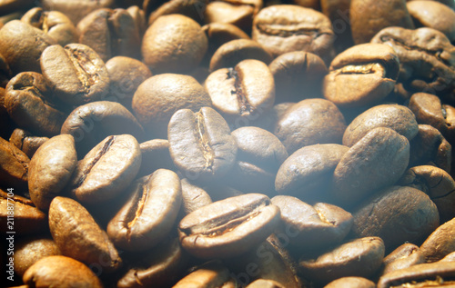 Roasted coffee beans close up.
