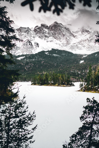 Blick auf den zu gefrorenen Eibsee von der Zugspitzbahn fotografiert in den Deutschen Alpen  photo