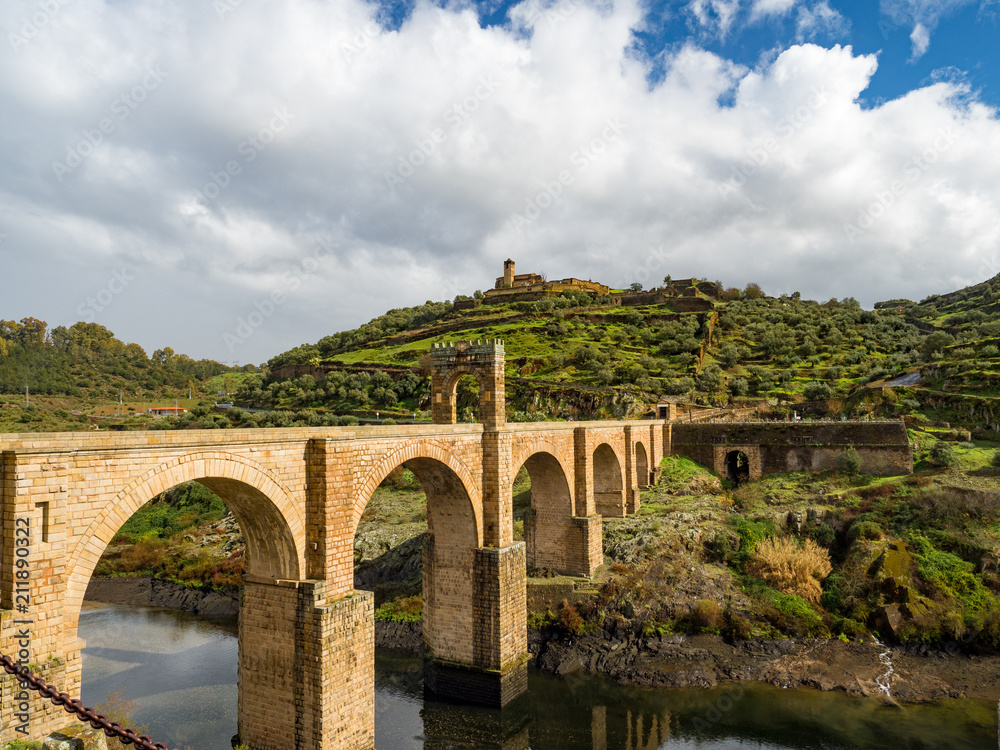 Beautiful view of the Alcantara Bridge, a Roman stone arch bridge built over the Tagus River, in Extremadura, Spain. March, 2018