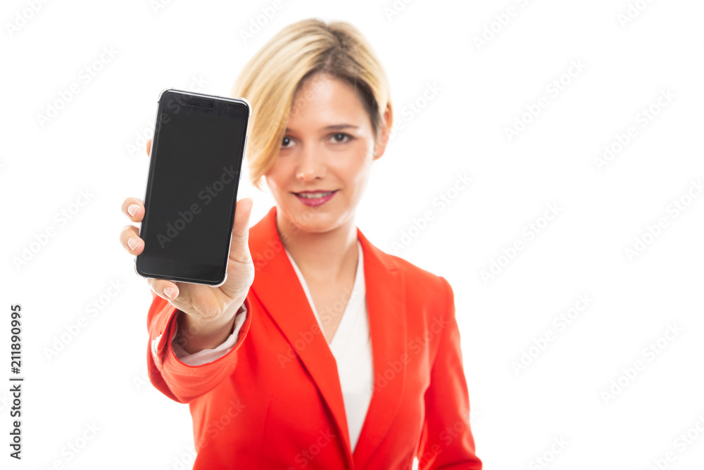 Selected focus of young business woman showing mobile phone.
