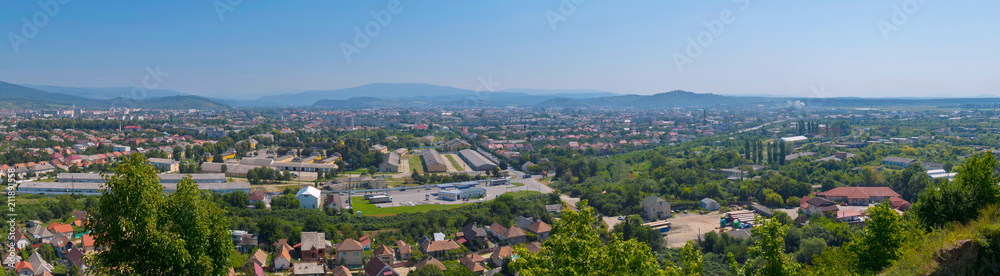 a magnificent panorama of the city with a beautiful nature lying in a green mountain valley