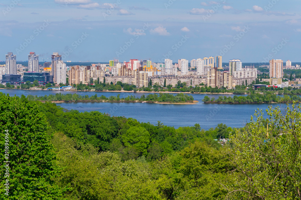 high-altitude urban area of the city and rolling along its waters a large river