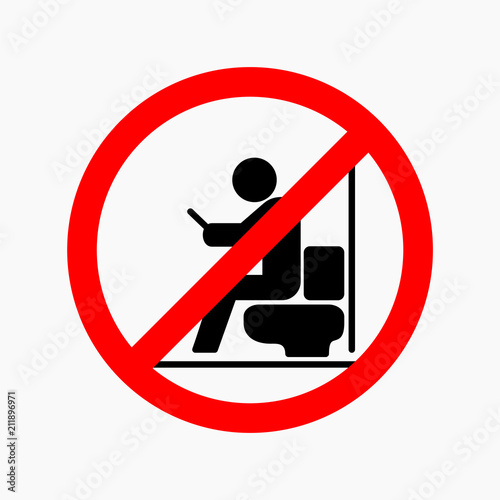 Man using smartphone in toilet. Not allowed sign