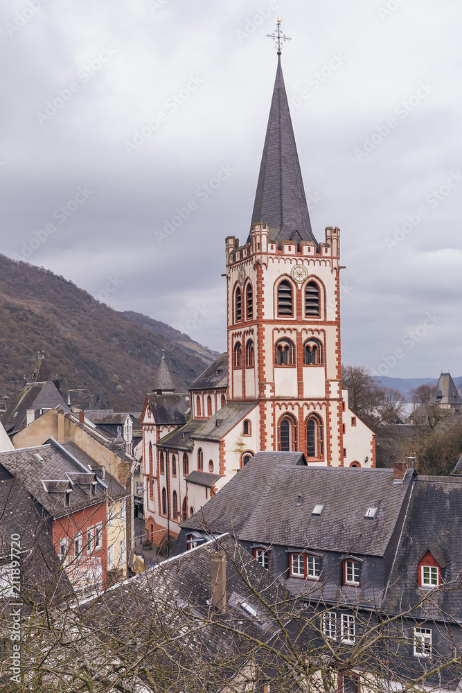 Fototapeta premium beautiful medieval cathedral against the background of mountains and cloudy sky