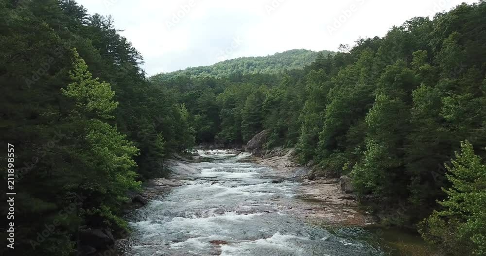 Aerial fly through close to the river going upstream as the camera follows the curves of Brown Mountain River Aerial fly through close to the river going upstream as the camera follows the curves of Brown Mountain River