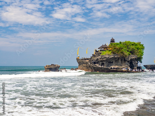 Tanah Lot is a big rock formation off the Indonesian island of Bali. It is home to the pilgrimage temple Pura Tanah Lot, a popular tourist and cultural icon for photography. November, 2017