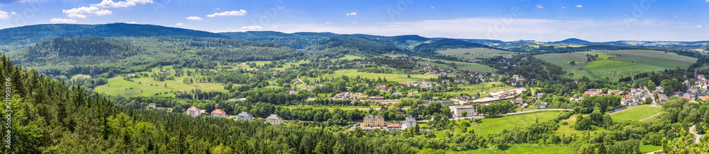 Aerial view of countryside landscape in mountain valley, panorama of town and houses in nature