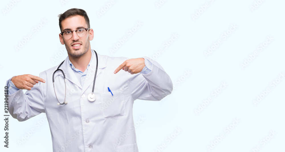 Handsome young doctor man looking confident with smile on face, pointing oneself with fingers proud and happy. Handsome young doctor man looking confident with smile on face, pointing oneself with fingers proud and happy.