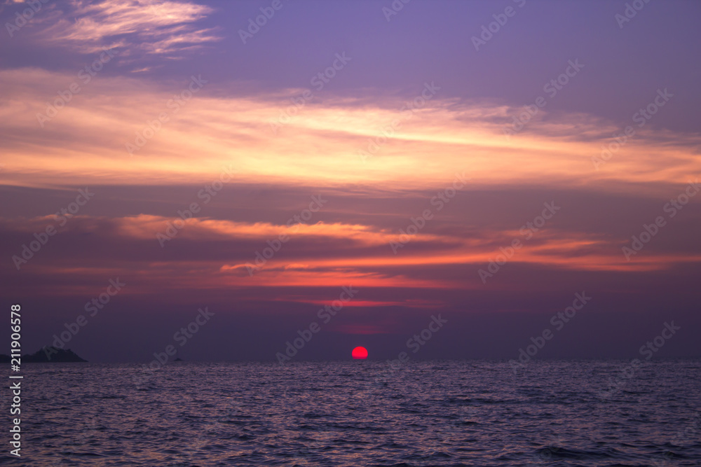 Sunset on the horizon in the sea