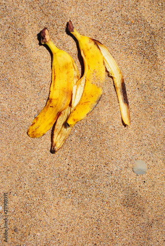Banana peel on the beach sand