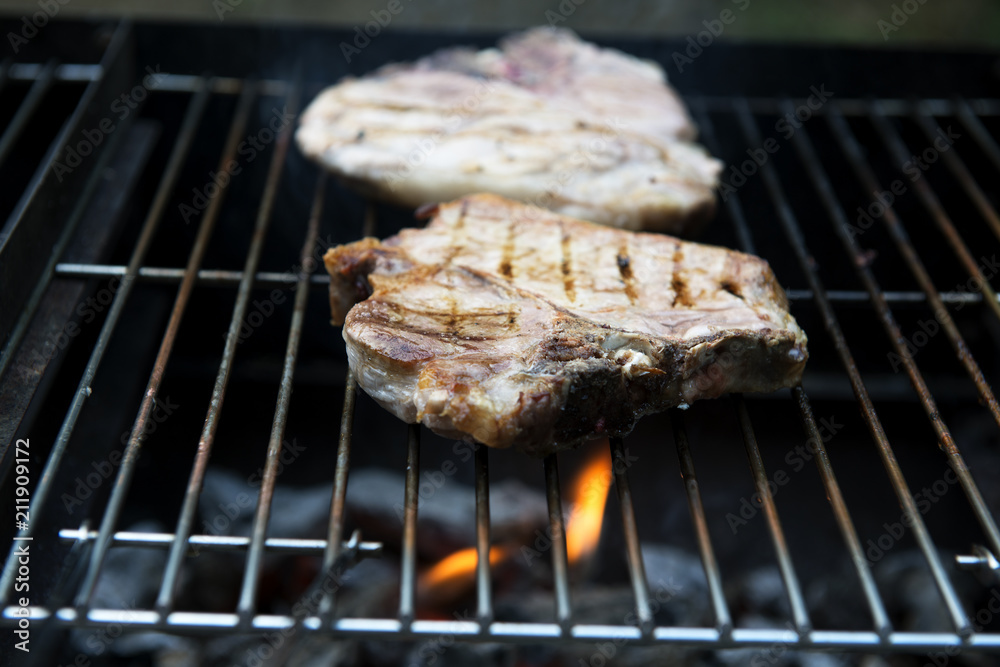 T-bone chop of pork on the grill T-bone chop of pork on the grill