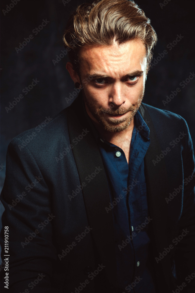 Fototapeta premium Portrait of an emotional caucasian man in studio